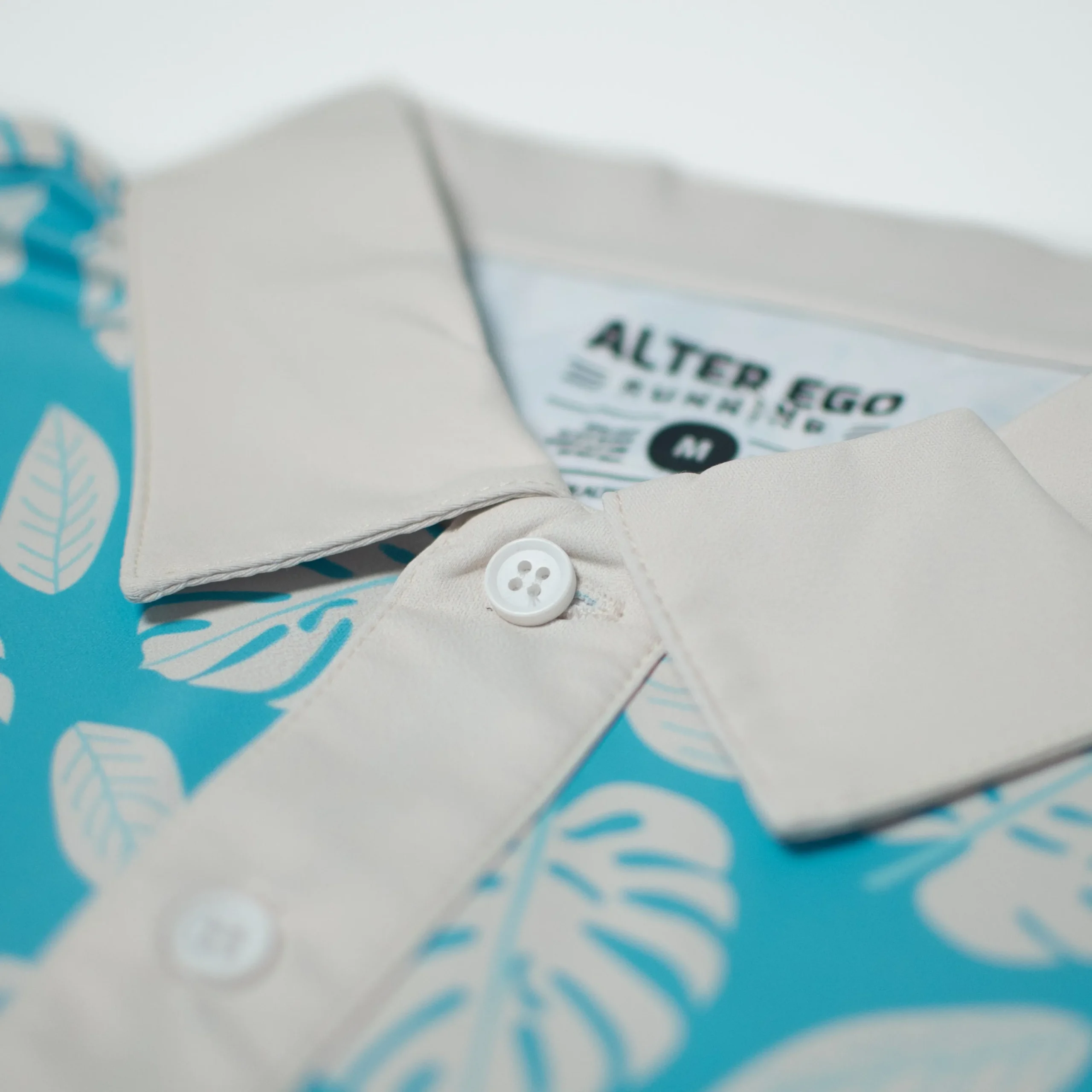 performance-polo-palm-print-te-gJxPXaDy-2.webp Performance Polos|UNTUCKit Performance Polo Palm Print Teal